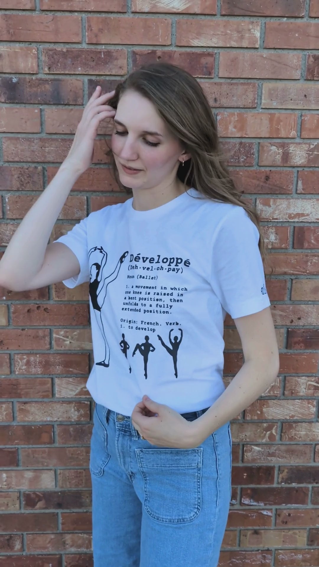 Ballerina performing a developpé a la seconde on T shirt with definition printed in navy blue. Instructions for developpé in ballet