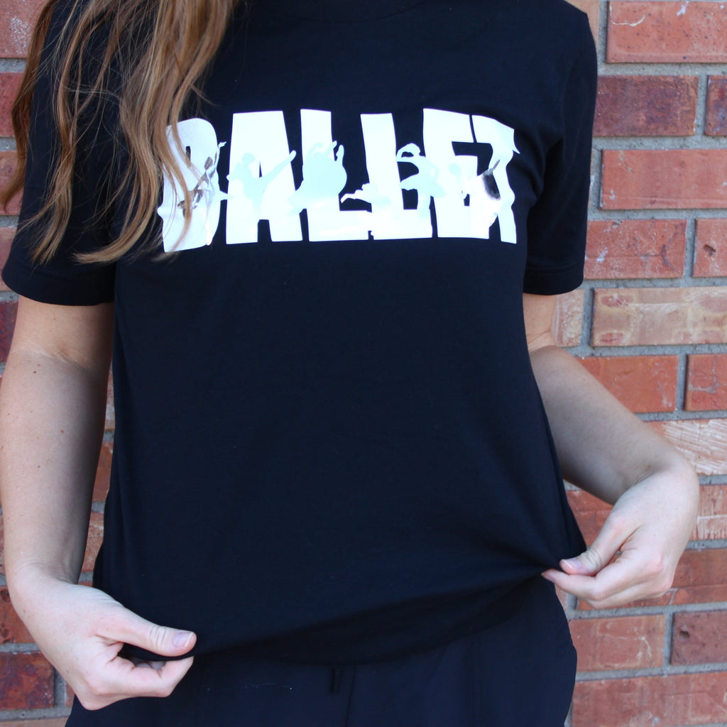 Ballet in white block letters on black t shirt with iconic ballet variations in silver silhouettes. La Esmeralda, Cupid and Kitri from Don Quixote, Dying Swan or Odette from Swan Lake, Raymonda, and Giselle Act 2.
